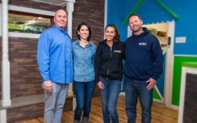 Four Hounds Town staff and owners standing in a