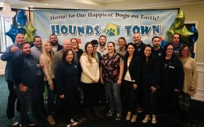 Smiling Hounds Town dog daycare franchise owners gathered