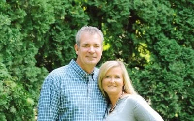 The Darwins, a smiling couple,