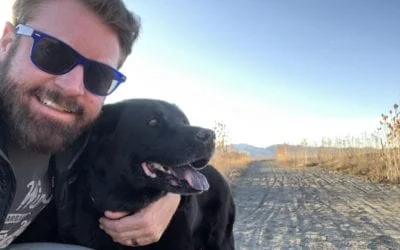 Smiling man in blue sunglasses with a