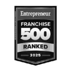 Hounds Town's 2025 Franchise 500 Ranked award badge showcasing their excellence in dog daycare services.
