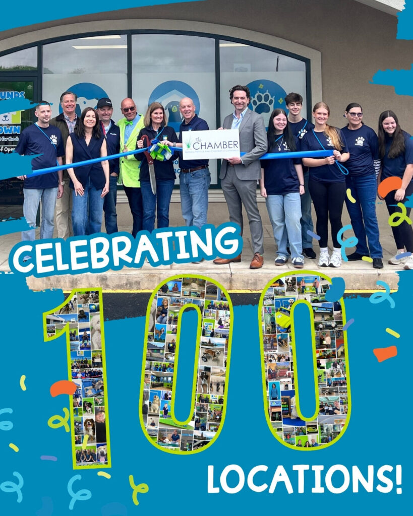 Hounds Town team celebrating the opening of the brand's 100th location